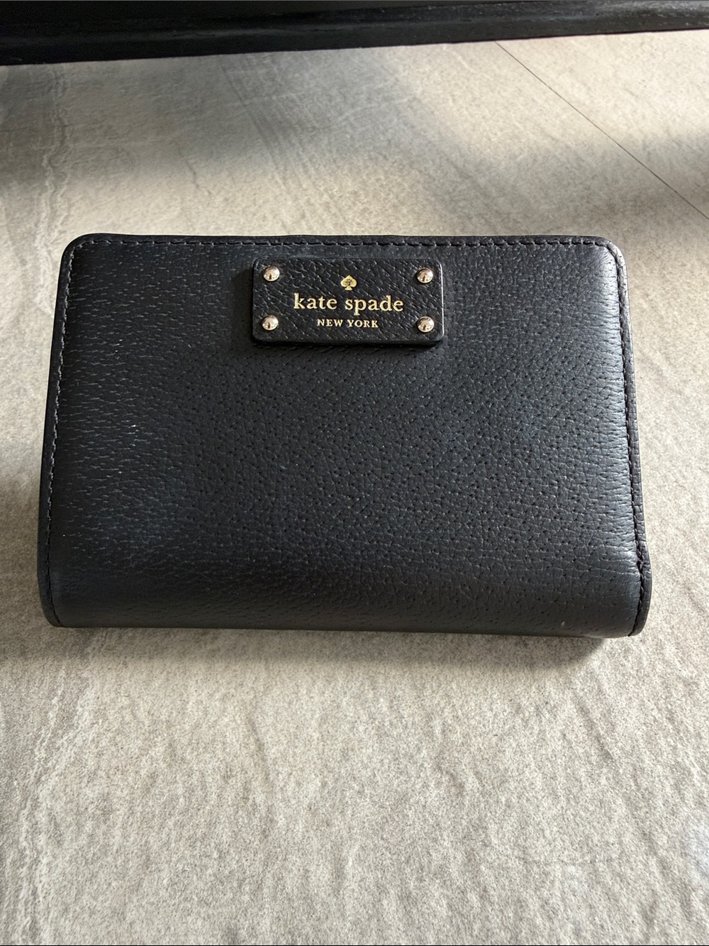 kate spade Black Pebbled Leather Compact Wallet with Gold Logo